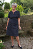 Lindsey Dress in Navy/white spot Front zip Sizes 14 and 16 only